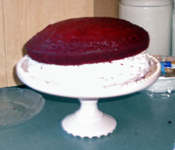 Red Velvet Cake: Lopsided second layer atop the first.
