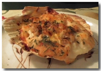 Coquille St. Jacques (Seared Scallops) served in scallop shell.