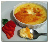 Creme Brulee (Burnt Custard) with fresh strawberries.