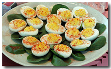 Deviled Eggs. (Suggestion: Serve on a bed of arranged whole basil leaves).