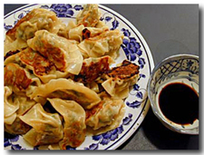 Fried Gyoza (Japanese Pot Stickers) with dipping sauce.