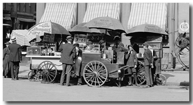 Hot dog stand in New York City (1906), when hot dogs were priced at 3-cents each.