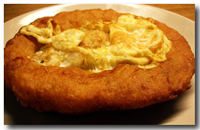 Sfinz (Libyan deep-fried breakfast pastry with egg)