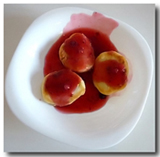 Syrniki (Fried-Cheese Pancakes) topped with jam.