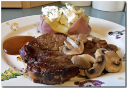 Chuck steak with mushrooms, Heinz 57, and a baked potato with sour cream. Click on image to view larger size in a new window.