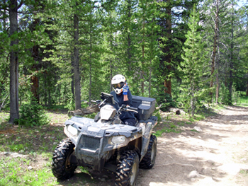 Riding an ATV and flipping the bird, Murdock Basin, Utah. Click on image to view larger size in a new window.